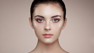 Beautiful woman face. Perfect makeup. Beauty fashion. Eyelashes. Cosmetic Eyeshadow. Highlighting