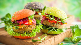Red, green,black mini burgers with quinoa and vegetables