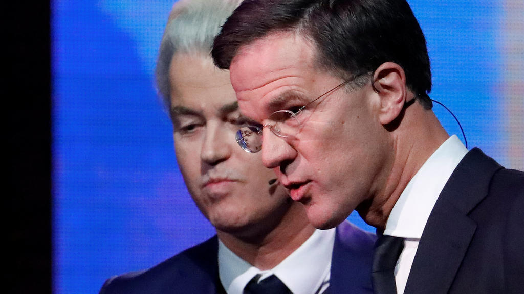 Dutch far-right politician Geert Wilders of the PVV party and Dutch Prime Minister Mark Rutte (R) of the VVD Liberal party take part in the "EenVandaag" debate in Rotterdam, Netherlands, March 13, 2017. REUTERS/Yves Herman