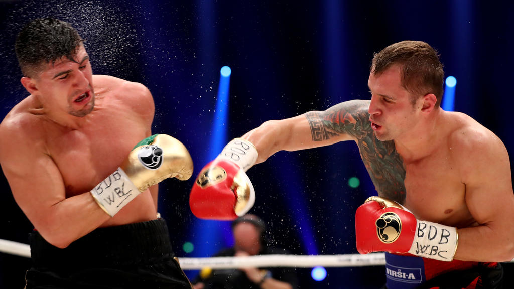 DORTMUND, GERMANY - APRIL 01: Marco Huck (L) of Germany and Mairis Briedis of Latvia exchange punches during their WBC Cruiserweight World Championship title fight at Westfalenhalle on April 1, 2017 in Dortmund, Germany. (Photo by Martin Rose/Bonga