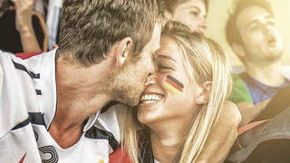 Germany fans kiss during a match.