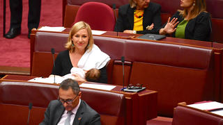 Australian Senator Larissa Waters reacts as she breastfeeds her baby in the Senate Chamber at Parliament House in Canberra, Australia, May 9, 2017. AAP/Mick Tsikas/via REUTERS    ATTENTION EDITORS - THIS IMAGE WAS PROVIDED BY A THIRD PARTY. EDITORIAL USE ONLY. NO RESALES. NO ARCHIVE. AUSTRALIA OUT. NEW ZEALAND OUT.