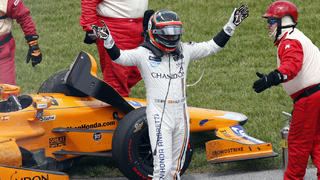 May 28, 2017; Indianapolis, IN, USA; Verizon IndyCar Series driver Fernando Alonso acknowledges the fans after his engine blew in turn one knocking him out of the 101st Running of the Indianapolis 500 at Indianapolis Motor Speedway. Mandatory Credit: Brian Spurlock-USA TODAY Sports
