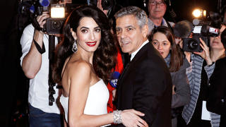 FILE PHOTO --  Actor George Clooney and his wife Amal pose as they arrive at the 42nd Cesar Awards ceremony in Paris, France, February 24, 2017.  REUTERS/Gonzalo Fuentes/File Photo
