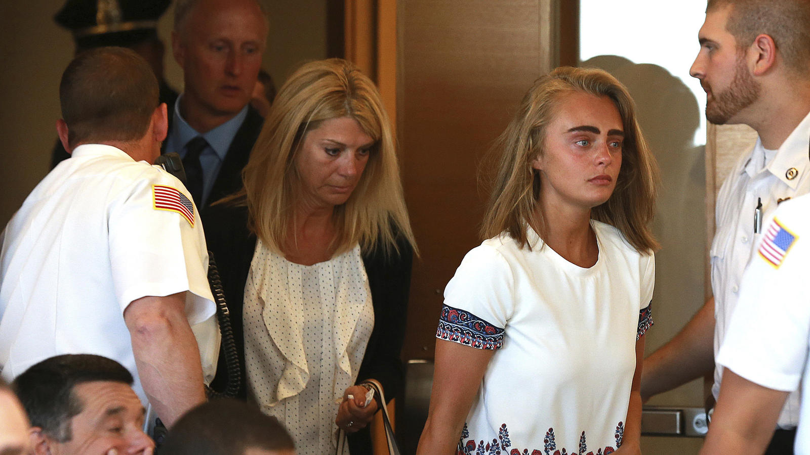 Followed by her parents, Michelle Carter arrives for her sentencing at a courtroom in Taunton, Mass., Thursday, Aug. 3, 2017, for involuntary manslaughter for encouraging Conrad Roy III to kill himself in July 2014. (Matt West/The Boston Herald via A