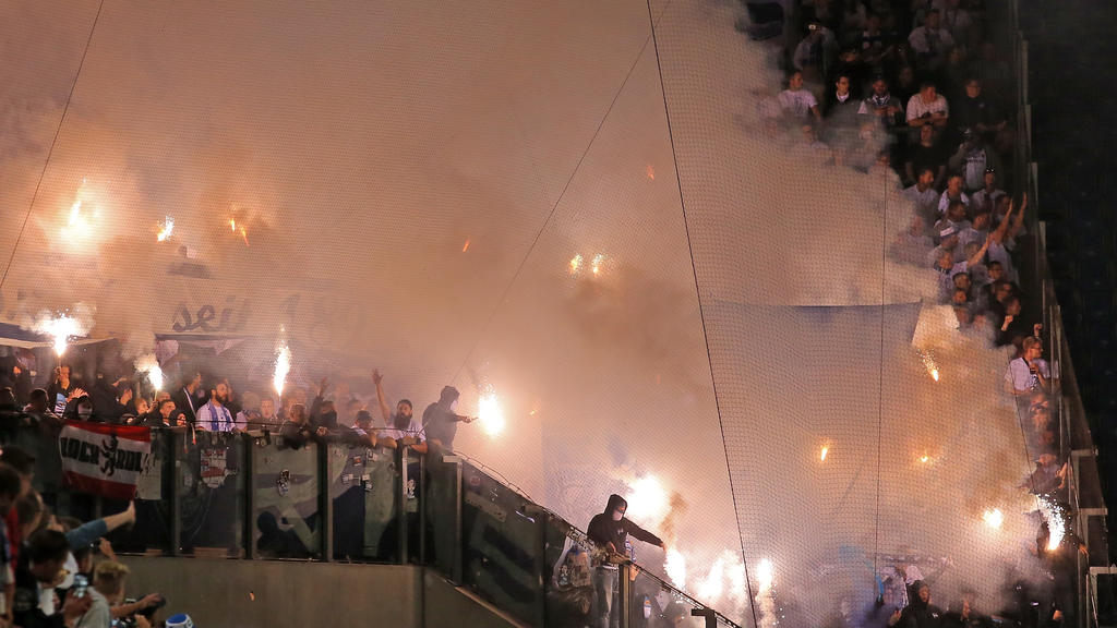 ROSTOCK, GERMANY - AUGUST 14: Supporters of Berlin use pyrotechnical articles during the DFB Cup first round match between FC Hansa Rostock and Hertha BSC at Ostseestadion on August 14, 2017 in Rostock, Germany. (Photo by Matthias Kern/Bongarts/Get