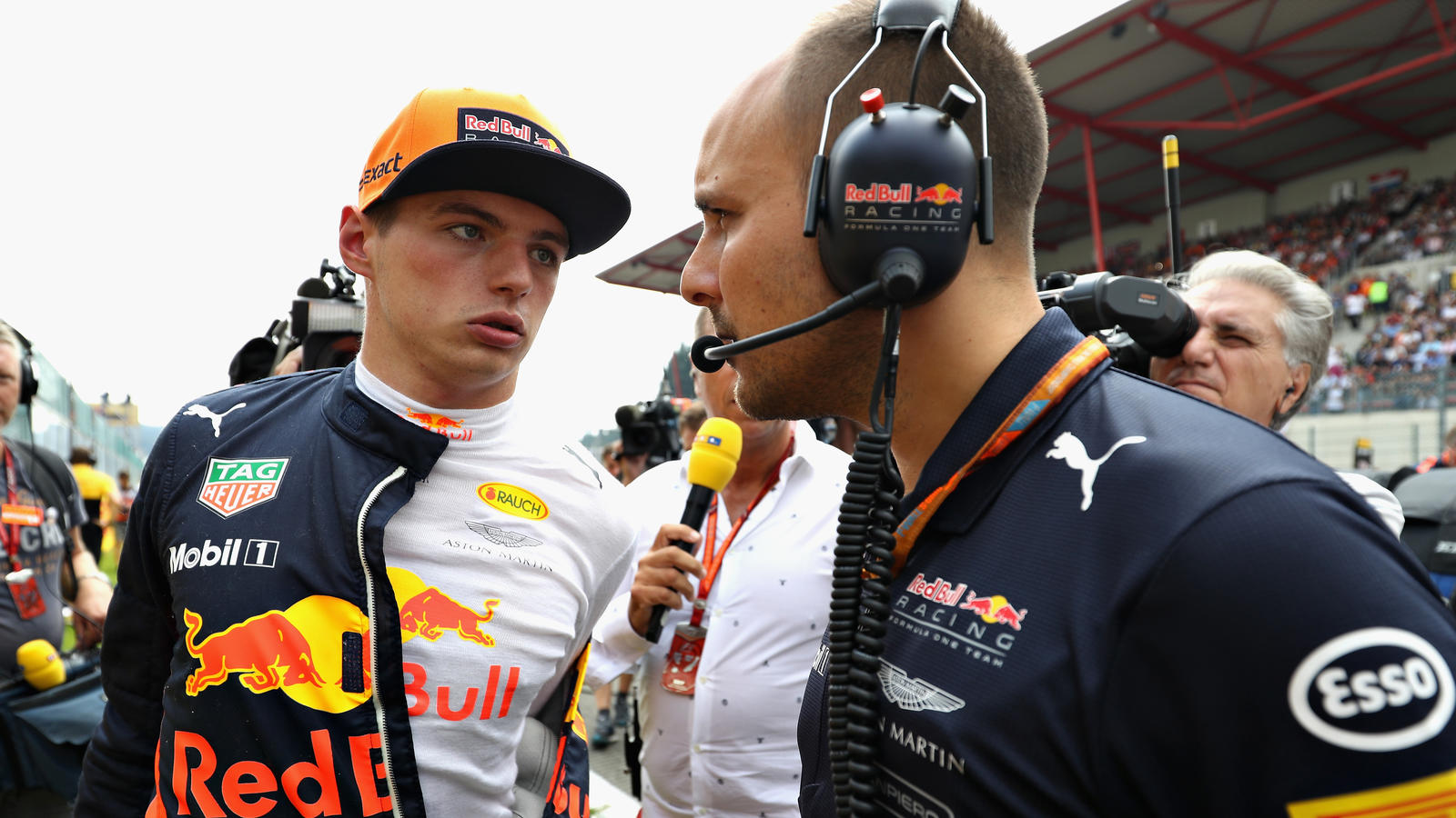 SPA, BELGIUM - AUGUST 27:  Max Verstappen of Netherlands and Red Bull Racing talks with race engineer Gianpiero Lambiase on the grid before the Formula One Grand Prix of Belgium at Circuit de Spa-Francorchamps on August 27, 2017 in Spa, Belgium.  (Ph