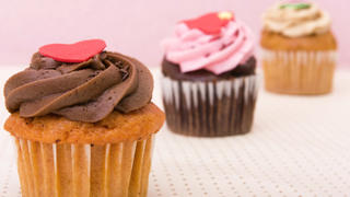 Three delicious cupcakes with special decorations - Focus only on the first one