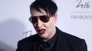 FILE PHOTO - Singer Marilyn Manson poses for photographers at the Fashion Awards 2016 in London, Britain December 5, 2016. REUTERS/Neil Hall/File Photo