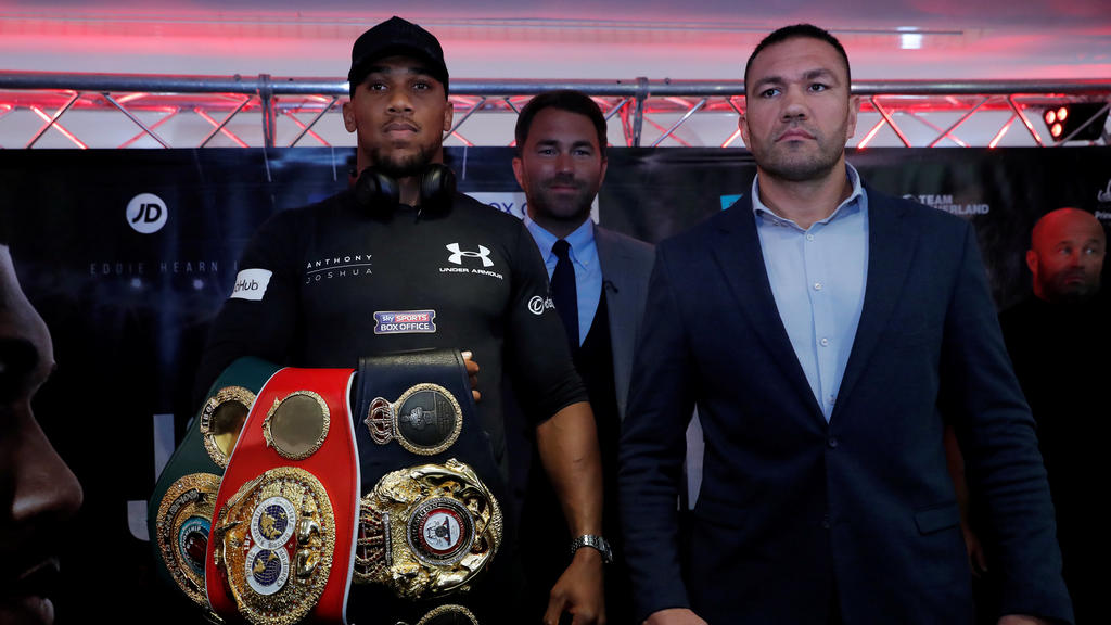 Boxing - Anthony Joshua and Kubrat Pulev Press Conference - Cardiff, Britain - September 11, 2017 Anthony Joshua and Kubrat Pulev pose with promoter Eddie Hearn during the press conference Action Images via Reuters/Andrew Couldridge