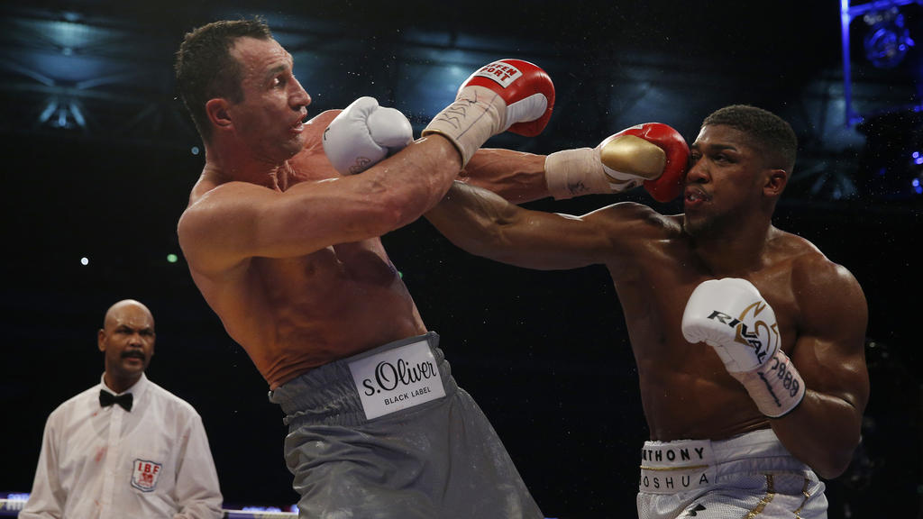 Britain Boxing - Anthony Joshua v Wladimir Klitschko IBF, IBO & WBA Super World Heavyweight Title's - Wembley Stadium, London, England - 29/4/17 Anthony Joshua in action with Wladimir Klitschko Action Images via Reuters / Andrew Couldridge Livepic ED