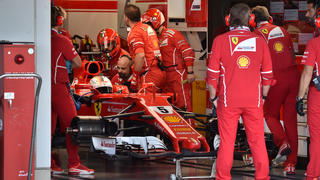 Ferrari's German driver Sebastian Vettel waits for repairs in the pit during the Formula One Japanese Grand Prix at Suzuka Circuit on October 8, 2017. REUTERS/Kazuhiro Nogi/Pool