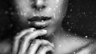 Beautiful woman behind window