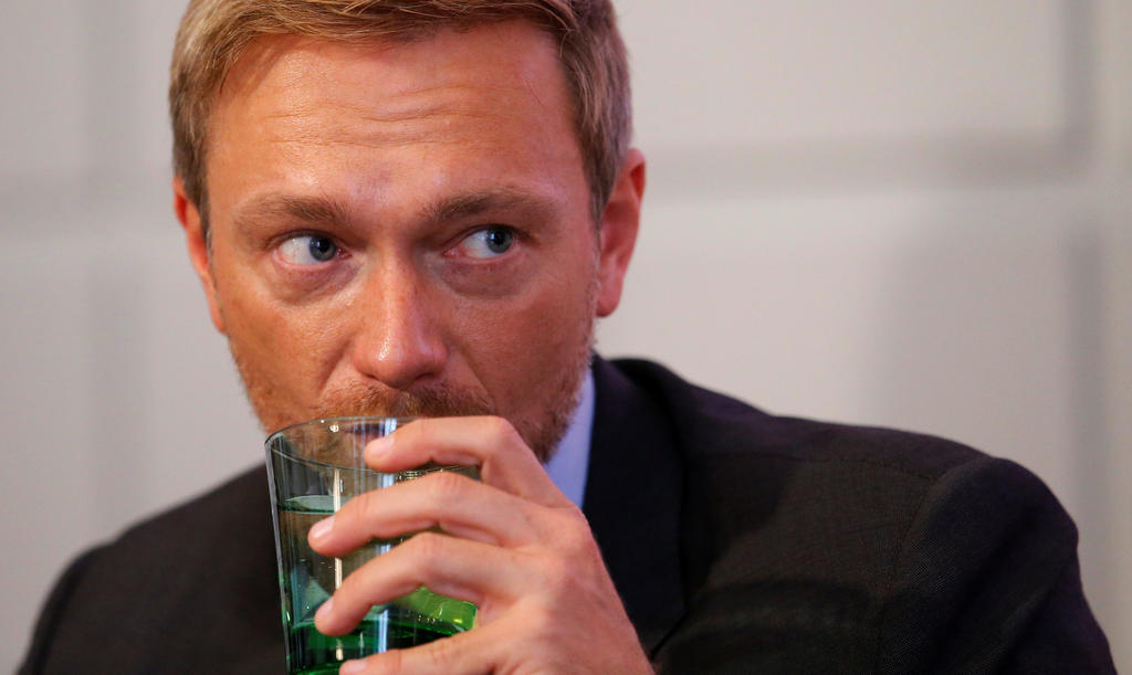 Germany's Free Democratic Party FDP leader Christian Lindner listens during a news conference in Vienna, Austria, October 11, 2017. REUTERS/Heinz-Peter Bader