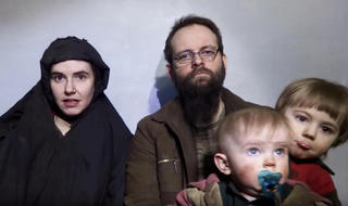 FILE PHOTO: A still image from a video posted by the Taliban on social media on December 19, 2016 shows American Caitlan Coleman (L) speaking next to her Canadian husband Joshua Boyle and their two sons.   Courtesy Taliban/Social media via REUTERS   ATTENTION EDITORS - THIS IMAGE HAS BEEN SUPPLIED BY A THIRD PARTY.