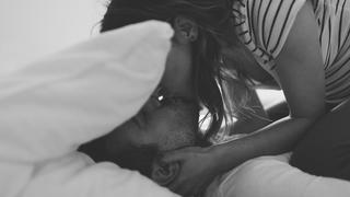 Lovely couple in pyjamas is getting ready for a good night sleep sealed with a kiss