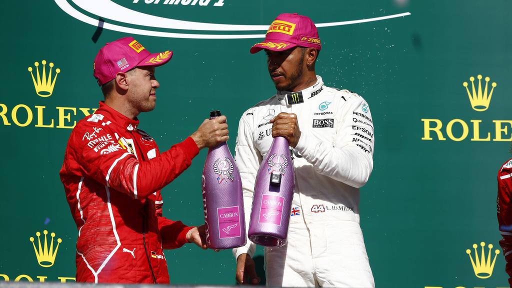 Circuit of the Americas, Austin, Texas, United States of America. Sunday 22 October 2017. Sebastian Vettel, Ferrari, 2nd Position, and Lewis Hamilton, Mercedes AMG, 1st Position, on the podium. World _ONZ8744 PUBLICATIONxINxGERxSUIxAUTxHUNxONLY