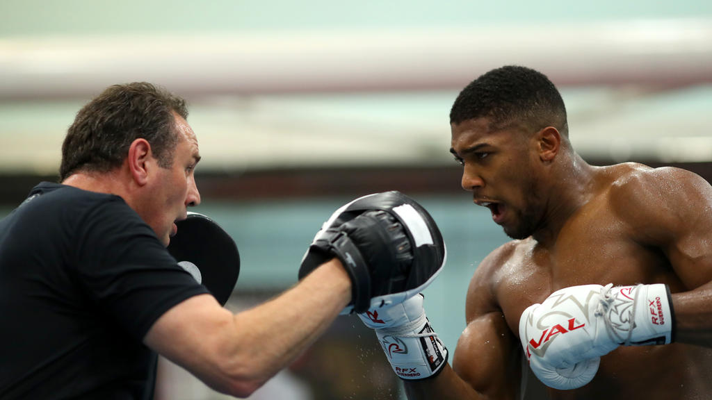 SHEFFIELD, ENGLAND - OCTOBER 17: Anthony Joshua works out with his trainer Rob McCracken during a media workout at the English Institute of Sport on October 17, 2017 in Sheffield, England. (Photo by Richard Heathcote/Getty Images)