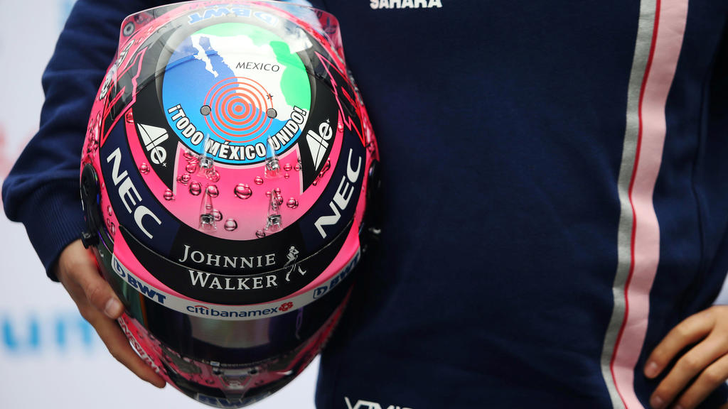 Sahara Force India's Sergio Perez holds a helmet that reads "All Mexico United", in allusion to the last earthquake, after a news conference ahead of the Mexican Grand Prix on October 29, in Mexico City, Mexico, October 25, 2017. REUTERS/Edgard Garri