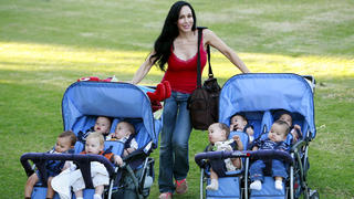 Nadya Suleman a.k.a "Octomom" looks in fab shape as she struggles with her eight babies on a trip to her local park in La Habra, California.