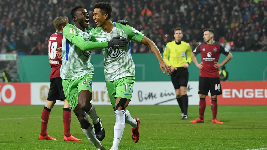 NUREMBERG, GERMANY - DECEMBER 19: Felix Uduokhai (r) celebrates with teammate Josuha Guilavogui of Wolfsburg scoring his teams first goal during the DFB Cup match between 1. FC Nuernberg and VfL Wolfsburg at Max-Morlock-Stadion on December 19, 2017 i