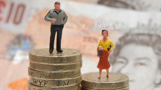 Gender pay gap. File photo dated 27/01/15 of plastic models of a man and woman standing on a pile of coins and bank notes. Men are significantly more likely than women to try to evade paying tax, researchers say. Issue date: Saturday December 23, 2017. A study of almost 1,500 people in the US, UK, Sweden and Italy found men under-report their income, while women are more honest. See PA story SOCIAL Tax. Photo credit should read: Joe Giddens/PA Wire URN:34239569 |