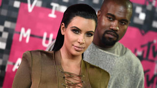 FILE - In this Aug. 30, 2015, file photo, Kim Kardashian, left, and Kanye West arrive at the MTV Video Music Awards at the Microsoft Theater in Los Angeles. Kardashian praised her husband's May 19, 2016, appearance on "The Ellen DeGeneres Show" on Twitter. (Photo by Jordan Strauss/Invision/AP, File) |