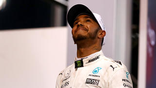 ABU DHABI, UNITED ARAB EMIRATES - NOVEMBER 26:  Second place finisher Lewis Hamilton of Great Britain and Mercedes GP celebrates with his trophy on the podium during the Abu Dhabi Formula One Grand Prix at Yas Marina Circuit on November 26, 2017 in Abu Dhabi, United Arab Emirates.  (Photo by Dan Istitene/Getty Images)