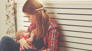 mother breast feeding her baby toddler