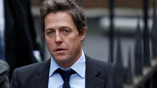 FILE PHOTO: British actor Hugh Grant arrives at the Leveson Inquiry at the High Court in central London, Britain November 21, 2011.   REUTERS/Andrew Winning/File Photo