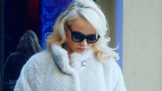 Pamela Anderson is warning the public about the risks involved with accepting a ride from taxi apps such as Uber. The former Baywatch star, 50, is appearing in a new advert called "The Signs", in which she looks for a cab on a chilly NYC street. As she waits in her fluffy white coat she sees billboards and a newspaper article which detail different accounts of sexual assaults and rape. She then steps into her car and watches nervously as the doors lock. The driver then turns to her and asks in a sinister tone: "Shall we?" Pammy then looks at her phone which has the "Me Too" hashtag on the screen. "When you accept a ride from a ride hailing app you also accept the risks that come with it," she says. "Many ride hail companies consider their drivers third party providers, so they don't have to accept any responsibility or accountability for their actions, always ride responsibly." This is the second ad that the actress has made on the subject. "The astounding number of tweets that referenced #MeToo and #uber was absolutely frightening, and disheartening to say the least," says Gary Buffo, President of the National Limousine Association (NLA), the organization that made the PSA. "It is time to recognize that these services are simply unsafe, and pose an inherent threat to anyone using them, due to the blatantly insufficient background checks that Transportation Network Companies (TNCs) use," he added. 