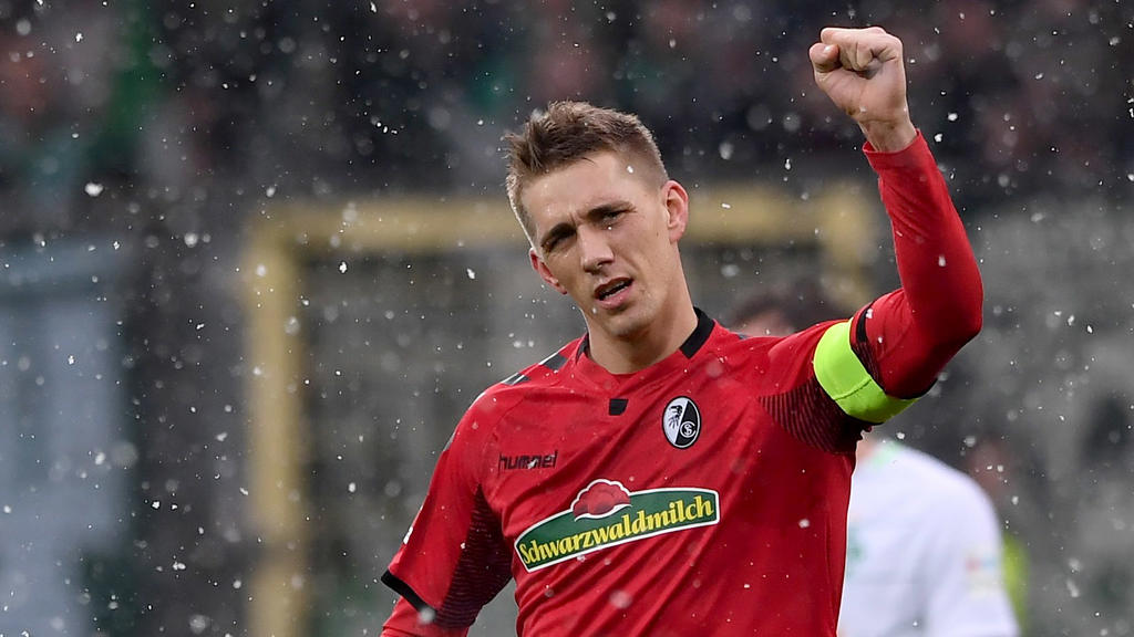 FREIBURG GERMANY - FEBRUARY 17: Nils Petersen of SC Freiburg celebrates his opening goal during the Bundesliga match between Sport-Club Freiburg and SV Werder Bremen at Schwarzwald-Stadion on February 17, 2018 in Freiburg, Germany.  (Photo by Michael