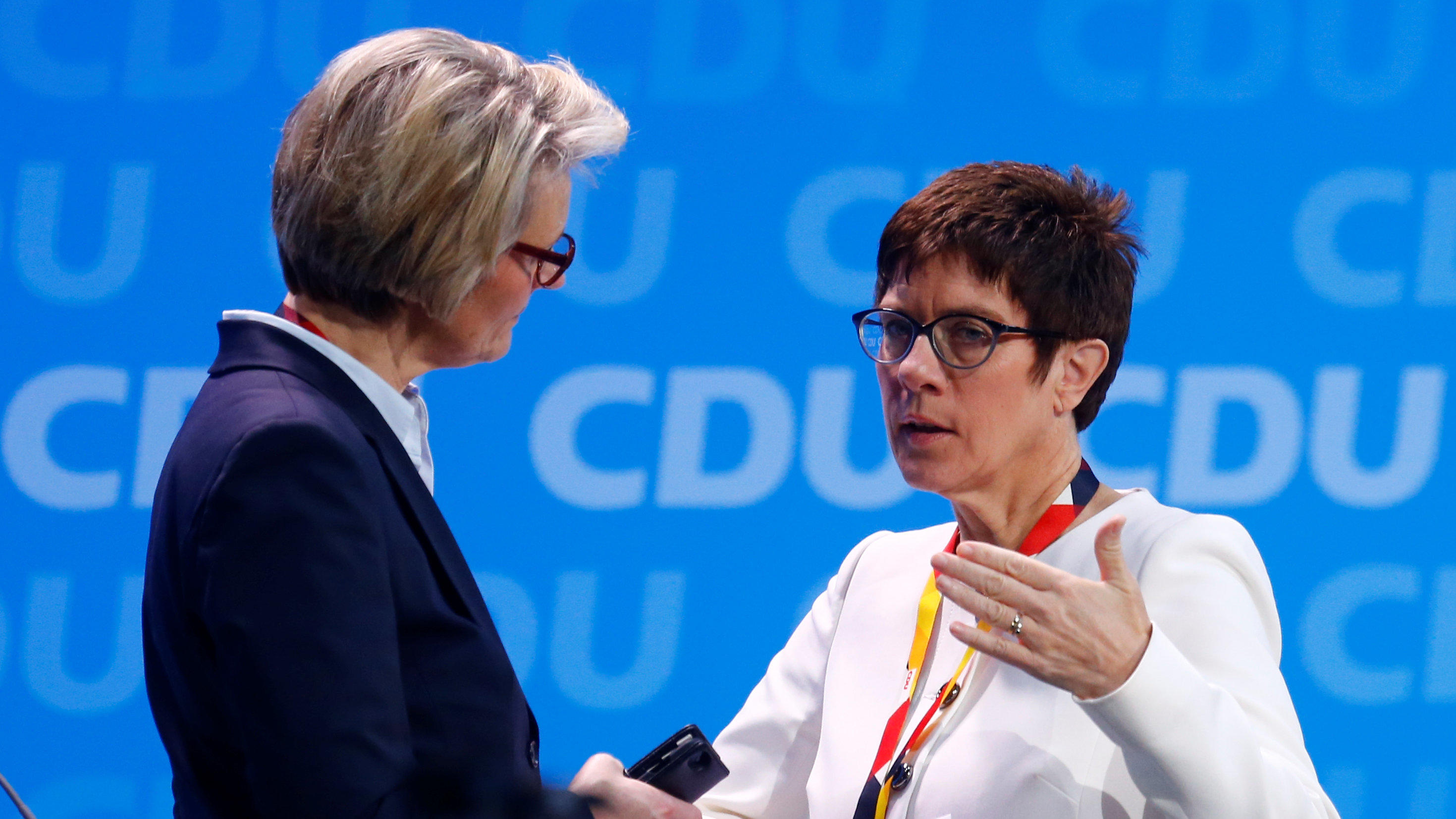 Anja Karliczek talks to Annegret Kramp-Karrenbauer before the Christian Democratic Union (CDU) party congress in Berlin, Germany, February 26, 2018.   REUTERS/Hannibal Hanschke