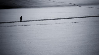 Man walking alone in snow