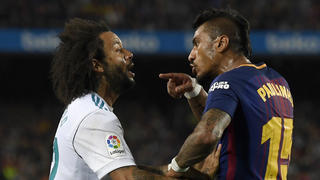 BARCELONA, SPAIN - MAY 06:  Paulinho of Barcelona clashes with Marcelo of Real Madrid during the La Liga match between Barcelona and Real Madrid at Camp Nou on May 6, 2018 in Barcelona, Spain.  (Photo by Alex Caparros/Getty Images)