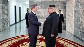 South Korean President Moon Jae-in shakes hands with North Korean leader Kim Jong Un during their summit at the truce village of Panmunjom, North Korea, in this handout picture provided by the Presidential Blue House on May 26, 2018.     The Presidential Blue House /Handout via REUTERS ATTENTION EDITORS - THIS IMAGE WAS PROVIDED BY A THIRD PARTY