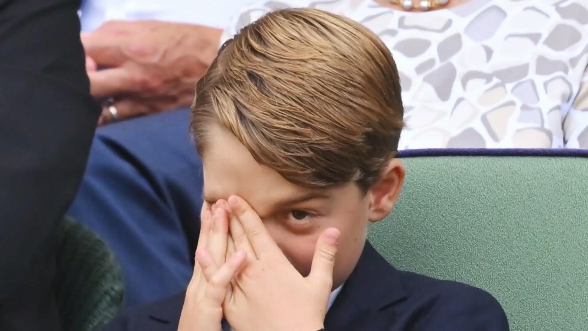 Prince George breaks a sweat in his suit Mini-Royal complains