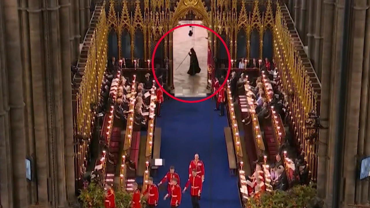 Is the grim reaper running through the picture here?  Coronation scare!