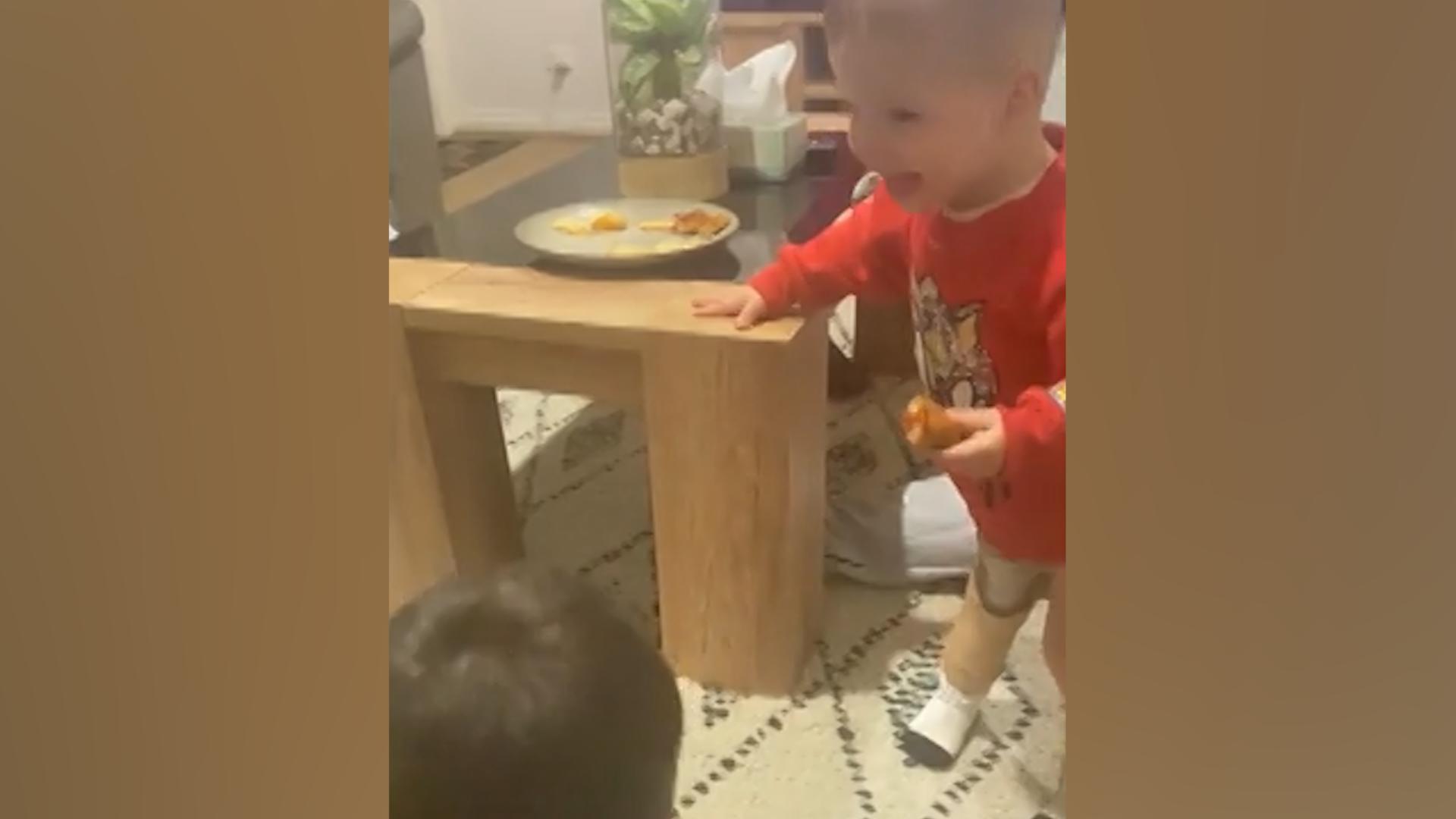 Magical Moment: A toddler trying on a suit for the first time laughs his head off!